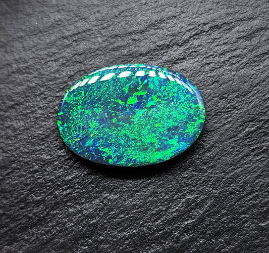 Large Museum grade black opal with a mossy, green-blue pinfire pattern