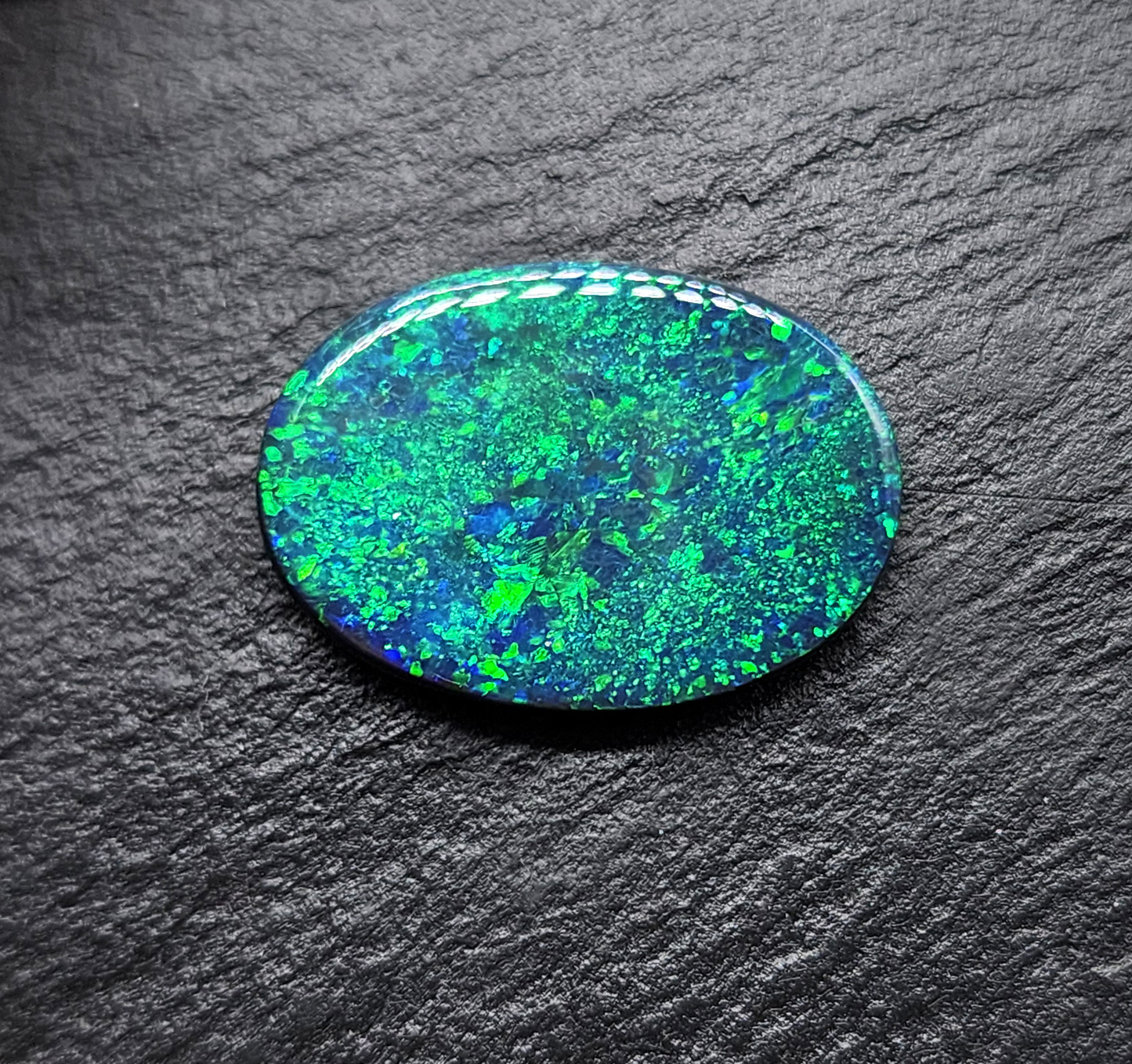 Large Museum grade black opal with a mossy, green-blue pinfire pattern