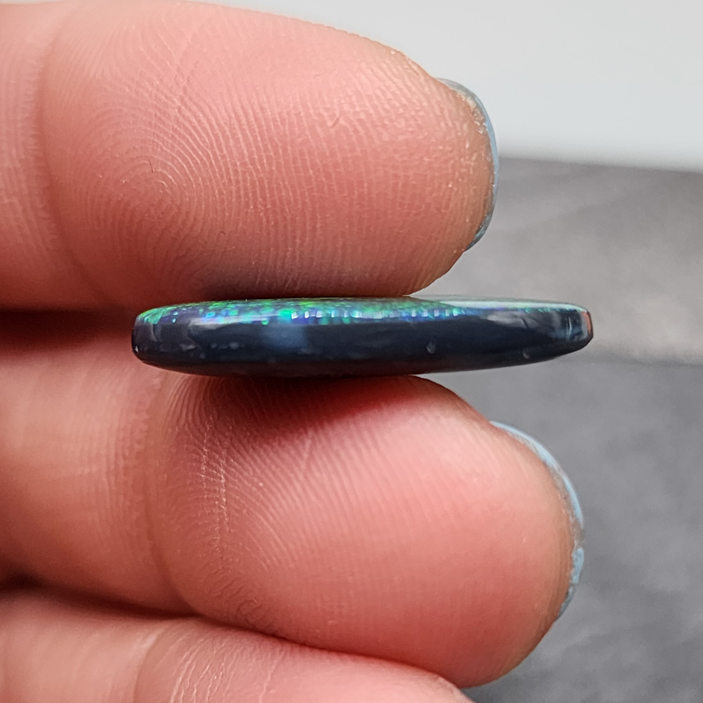 Large Museum grade black opal with a mossy, green-blue pinfire pattern