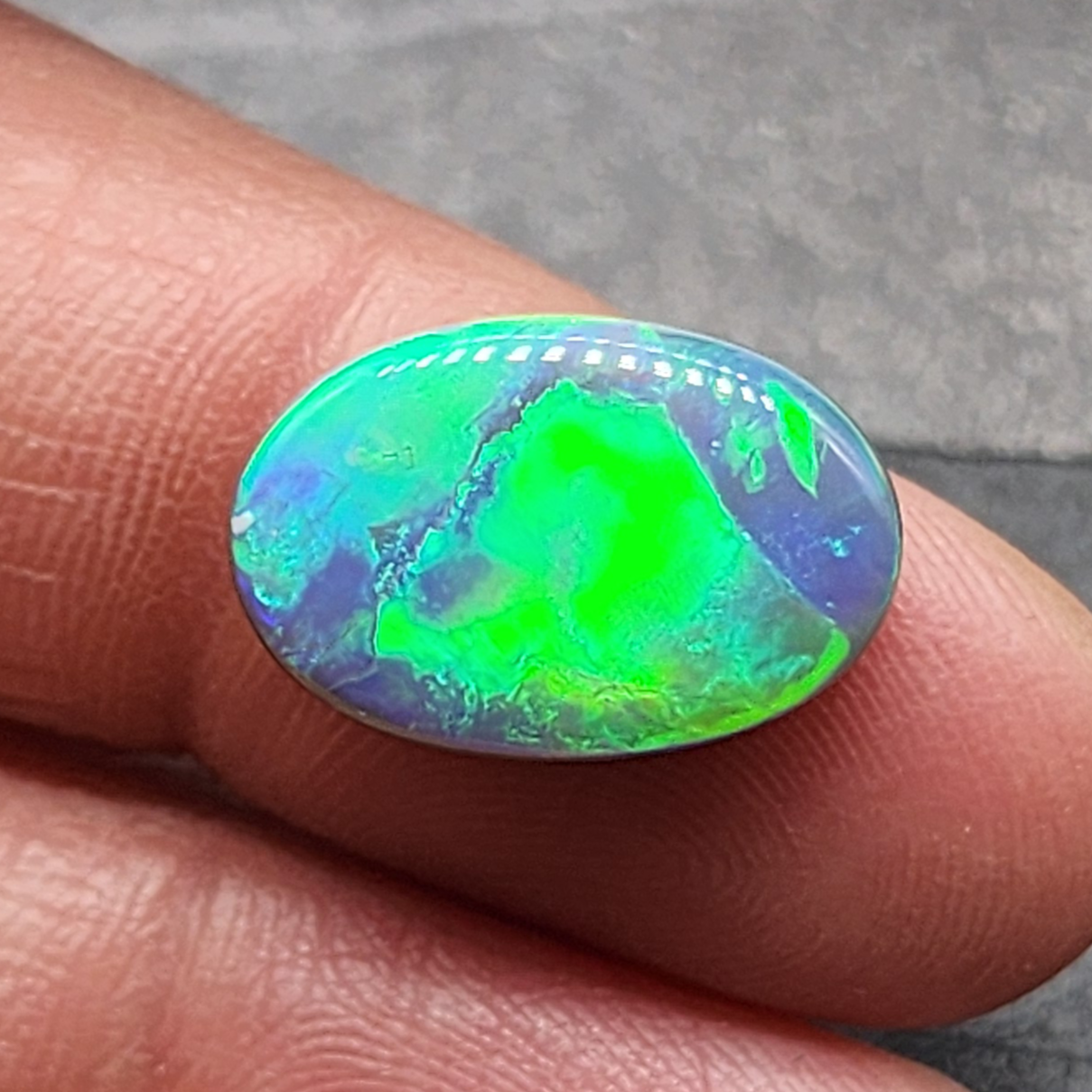 6.6cts Top gem black opal with vivid green-blue broad flash