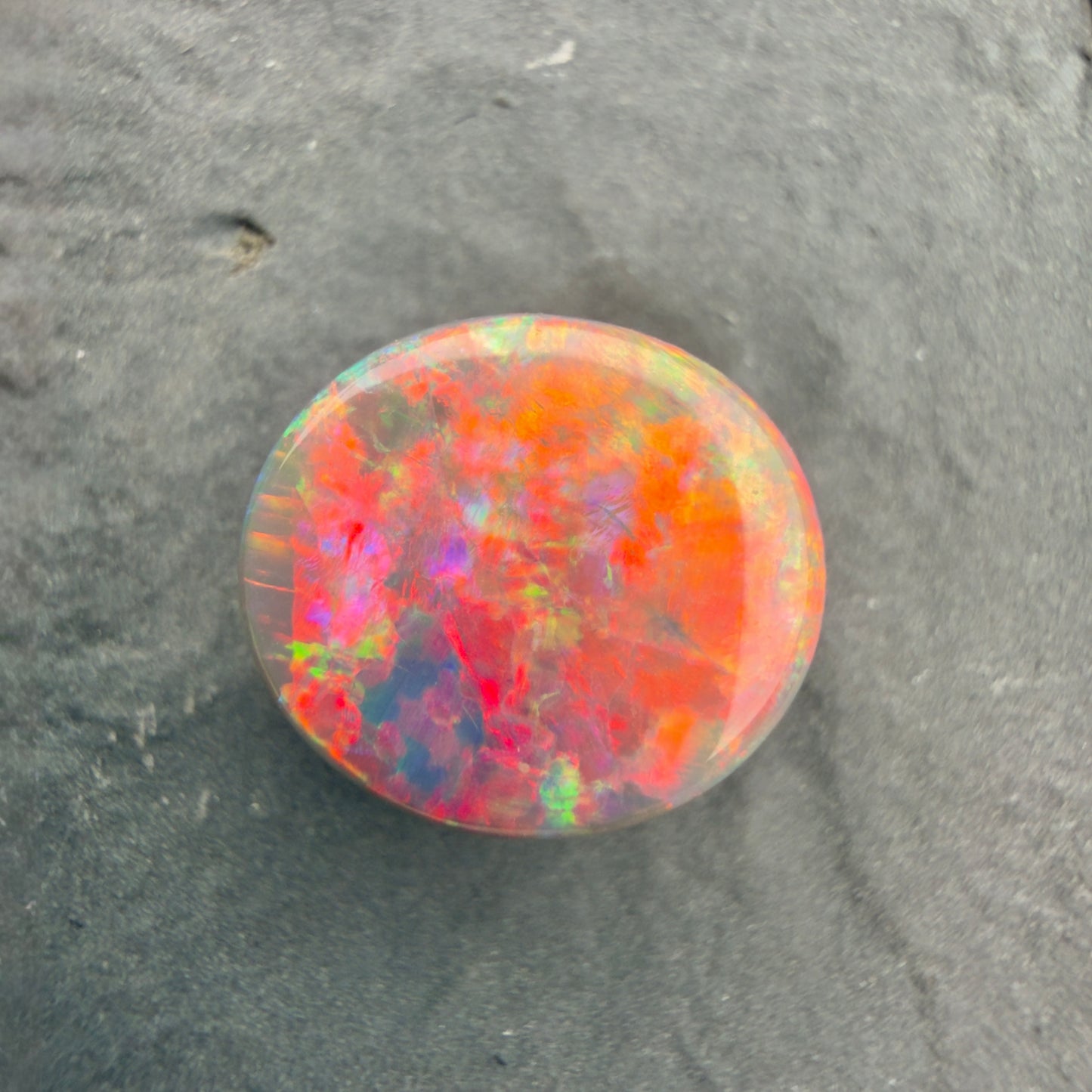 3.5ct Black Opal With A Rare Pink-Orange Broadflash Pattern, Shifting to Green As The Stone Is Moved (Copy)
