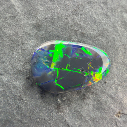 1.25cts Affordable Black Opal With A Green Yellow Gold Play Of Color, From Lightning Ridge Australia