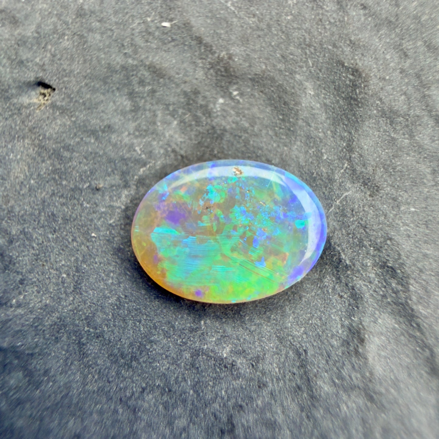 0.5cts Affordable Crystal Opal With A Vivid Green Blue Play Of Color, From Lightning Ridge Australia