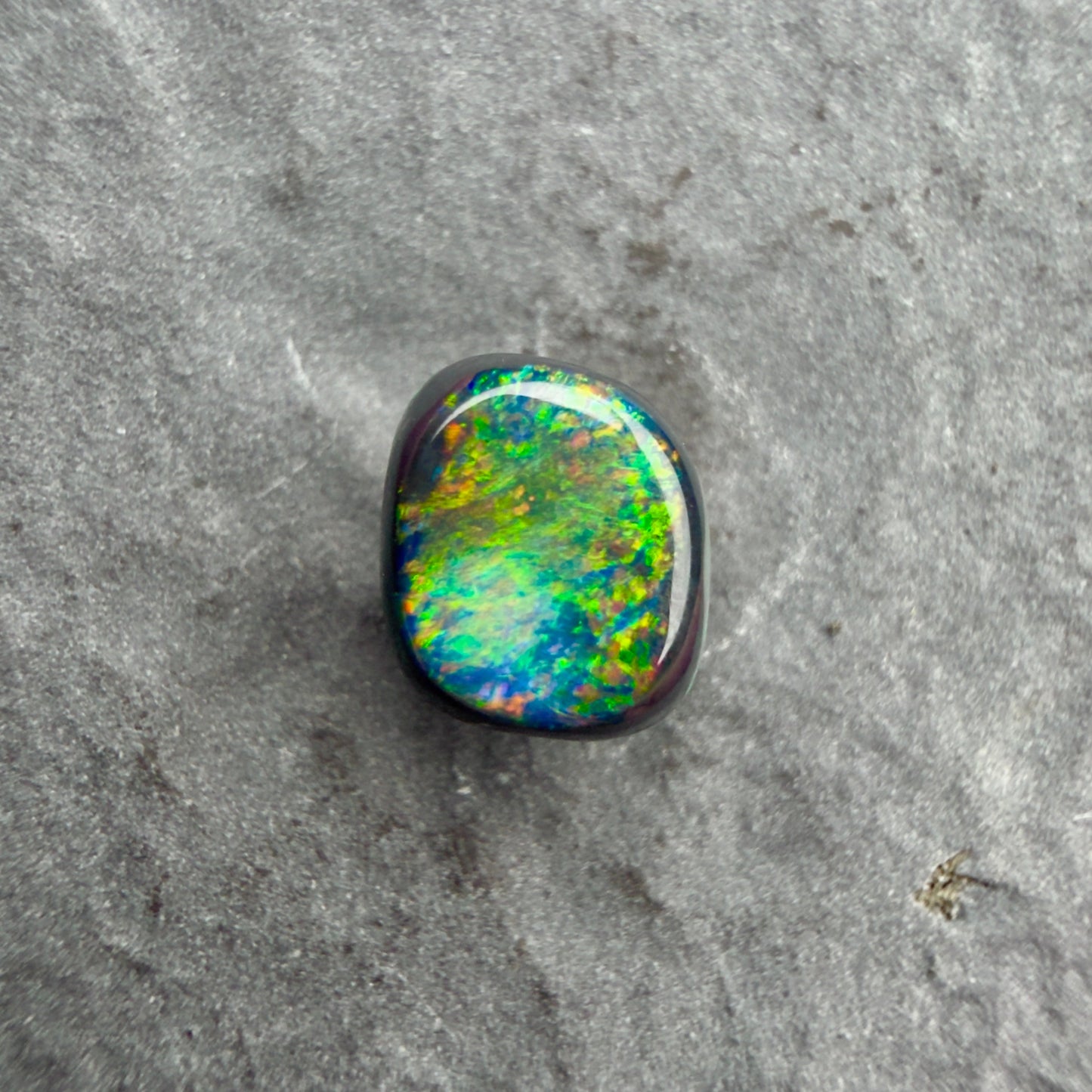 0.66cts Affordable Black Opal With A Vivid Red Pink Multicolor Play Of Color, From Lightning Ridge Australia