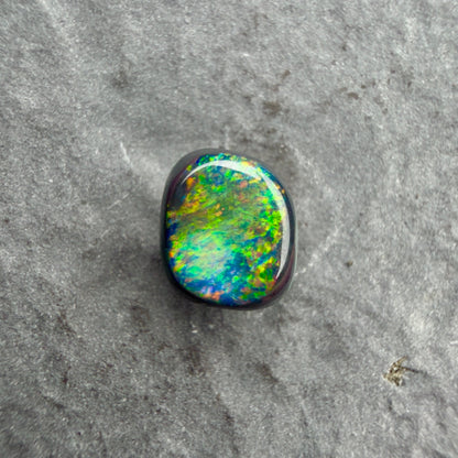 0.66cts Affordable Black Opal With A Vivid Red Pink Multicolor Play Of Color, From Lightning Ridge Australia