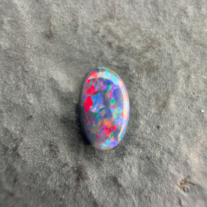 0.43cts Affordable Black Opal With A Vivid Red Pink Multicolor Play Of Color, From Lightning Ridge Australia