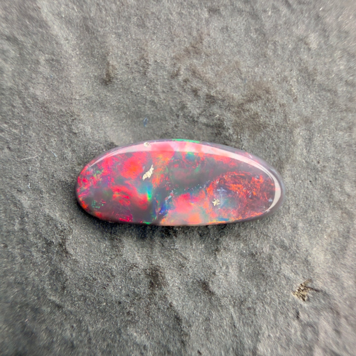 0.8cts Affordable Black Opal With A Vivid Red Pink Multicolor Play Of Color, From Lightning Ridge Australia