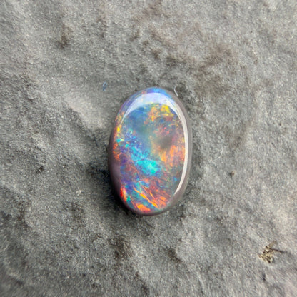0.61cts Affordable Black Opal With A Vivid Red Pink Multicolor Play Of Color, From Lightning Ridge Australia