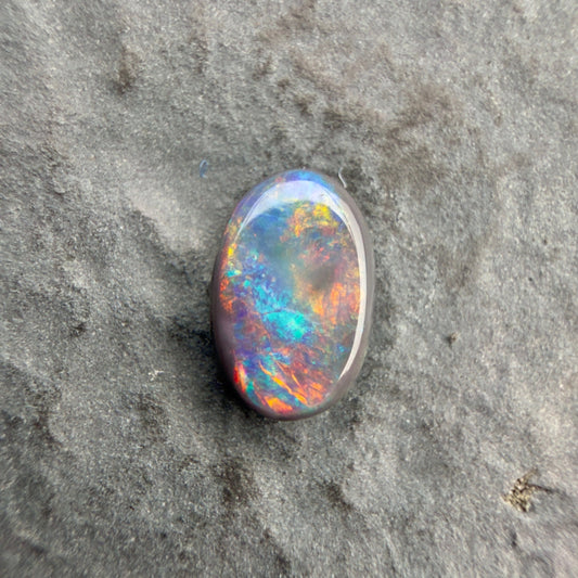 0.61cts Affordable Black Opal With A Vivid Red Pink Multicolor Play Of Color, From Lightning Ridge Australia