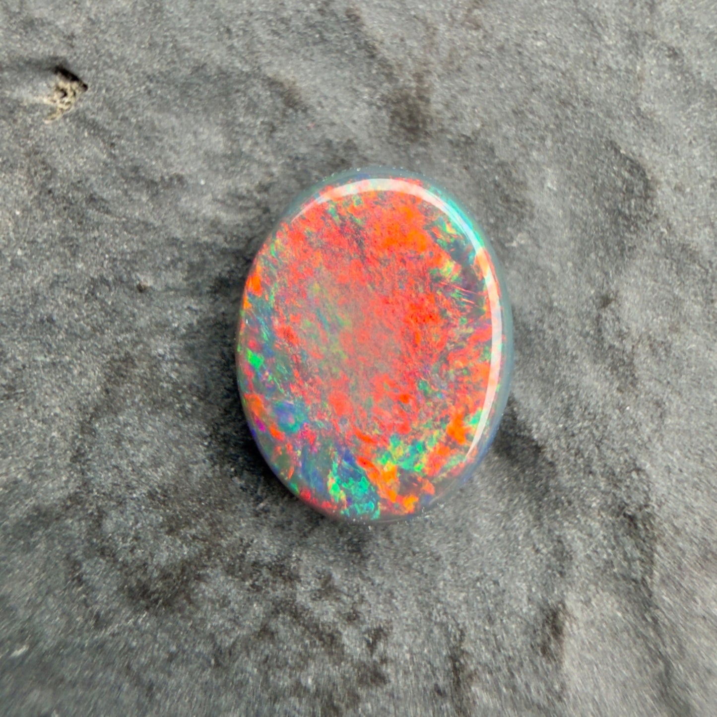 0.81ct Gem Black Opal With A Vivid Red Pink Multicolor Play Of Color, From Lightning Ridge Australia
