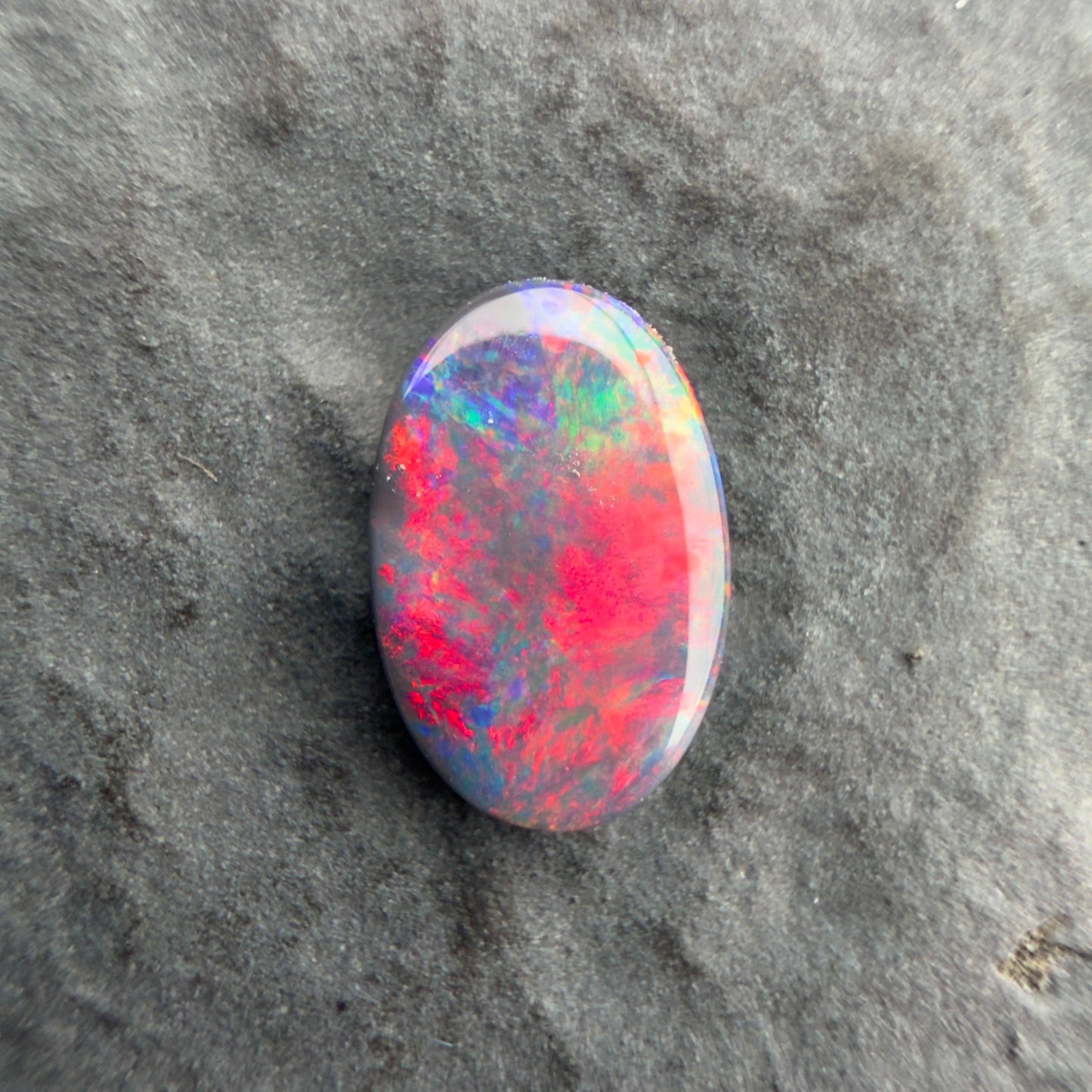 0.57cts Affordable Black Opal With A Vivid Red Pink Multicolor Play Of Color, From Lightning Ridge Australia