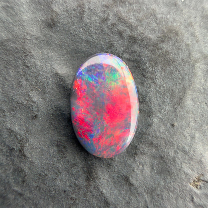 0.57cts Affordable Black Opal With A Vivid Red Pink Multicolor Play Of Color, From Lightning Ridge Australia