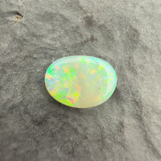 0.6cts Affordable Crystal Opal With A Green Yellow Gold Play Of Color, From Lightning Ridge Australia