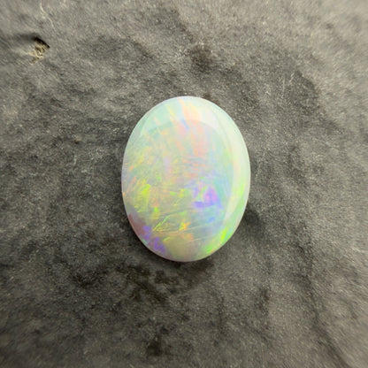 0.61cts Affordable Crystal Opal With A Green Yellow Gold Play Of Color, From Lightning Ridge Australia