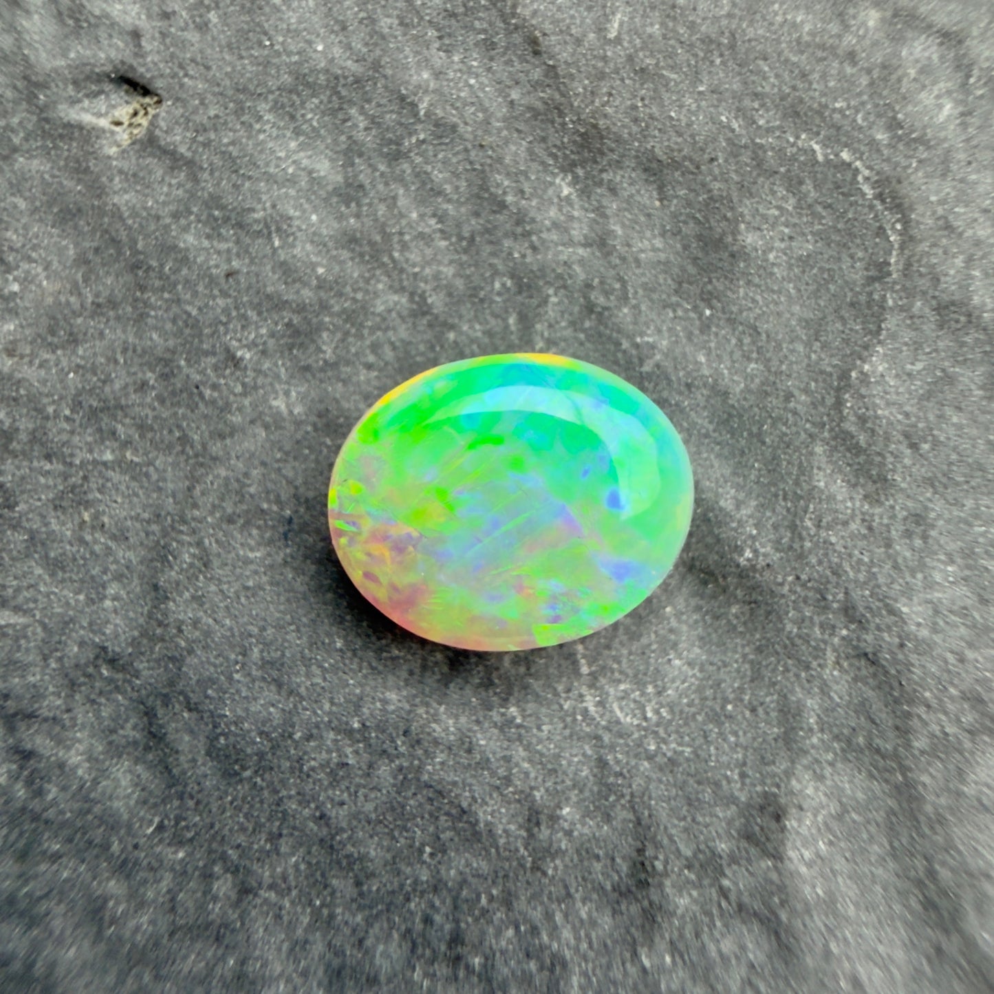 0.5cts Crystal Opal With A Green, Yellow, Gold Play Of Color, From Lightning Ridge Australia