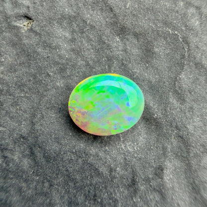 0.5cts Crystal Opal With A Green, Yellow, Gold Play Of Color, From Lightning Ridge Australia