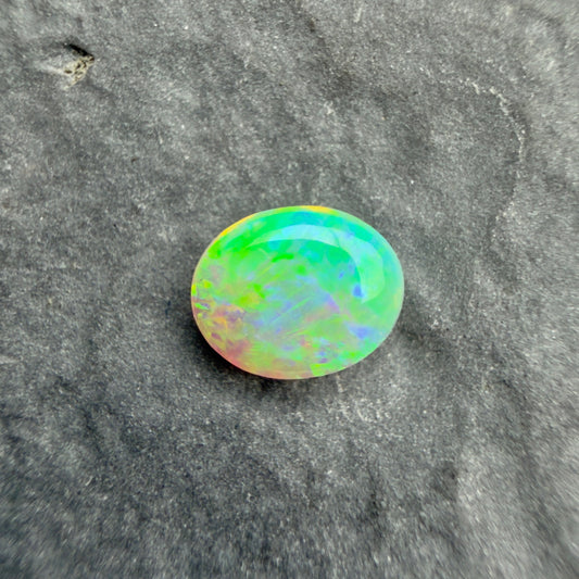 0.5cts Crystal Opal With A Green, Yellow, Gold Play Of Color, From Lightning Ridge Australia