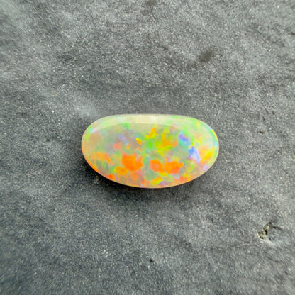 0.6cts Affordable Dark Opal With A Red Multicolor Play Of Color, From Lightning Ridge Australia