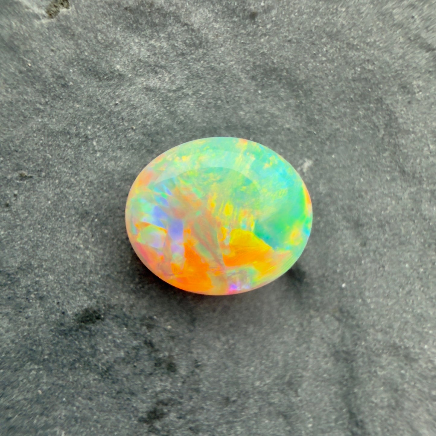 0.9cts Gem Dark Opal With A Green, Yellow, Gold Play Of Color, From Lightning Ridge Australia