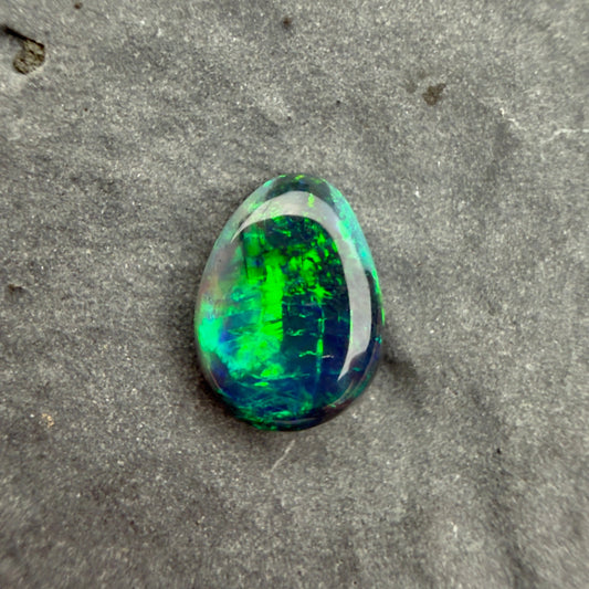 0.58cts Affordable Black Opal With A Blue Green Play Of Color, From Lightning Ridge Australia