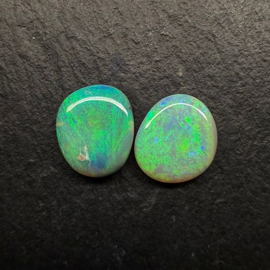 A Mismatched Pair Of Dark Opals With Moss patterns And A Minty Green Color Palette