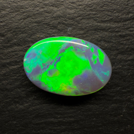 6.64ct World Class Black opal With Brilliant Green-Gold Color play And A Rolling Broad Flash Pattern