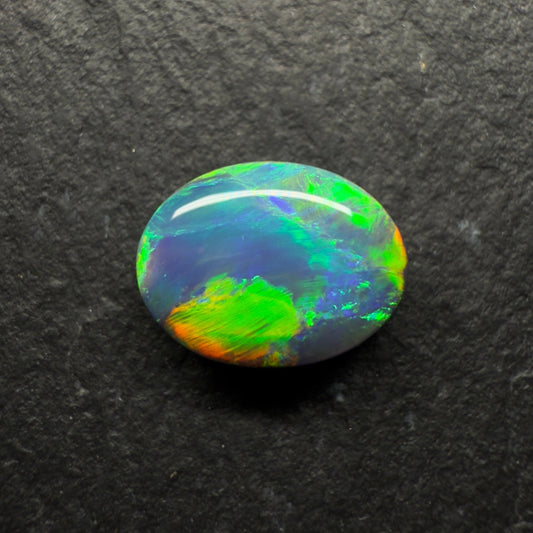1.6ct Gem Black Opal With A Lovely Green-Gold Color palette With Hints OF Teal And A Mixed Patterns