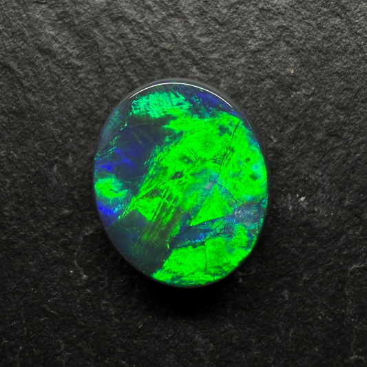 2.5ct Top Gem Black Opal With Avivid Dark Green Color Palette, Hints Of Blue And A Broad-flash Pattern