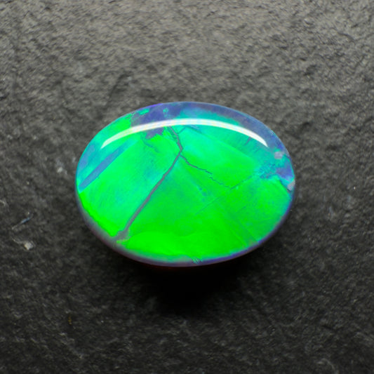 1.95ct World Class Black Opal. This Stone Has Blinding Green-Gold color Palette, With A Rolling Broadflash Pattern