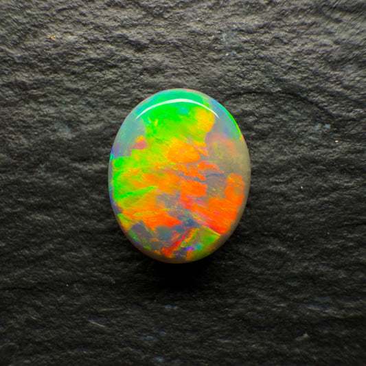 0.72ct Dark Opal With A Brilliant Green-Orange Broadflash Pattern