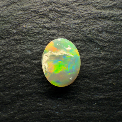 0.72ct Dark Opal With A Brilliant Green-Orange Broadflash Pattern
