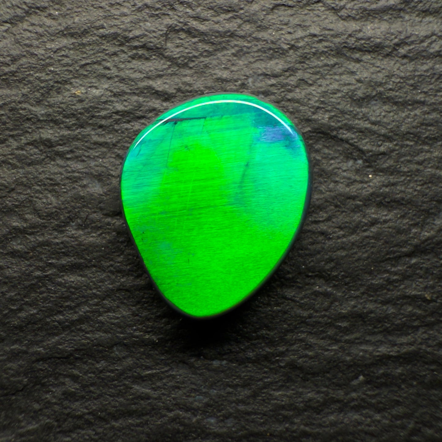 1.28 World Class Black Opal With A Blindingly Bright Metallic Green Rolling Broadflash Pattern