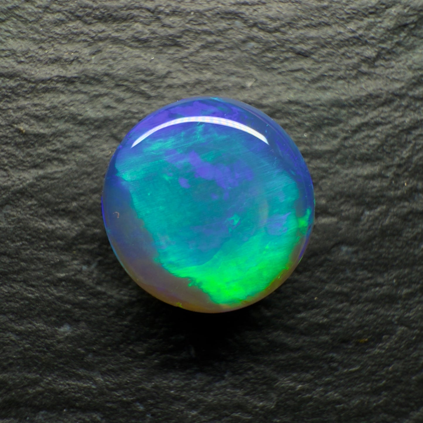 2.2ct Black Crystal Opal. This Gem Has A world Class Cats Eye Pattern And A Rare Teal-Purple Color Palette