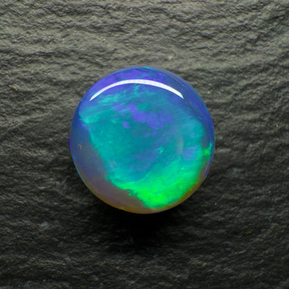 2.2ct Black Crystal Opal. This Gem Has A world Class Cats Eye Pattern And A Rare Teal-Purple Color Palette