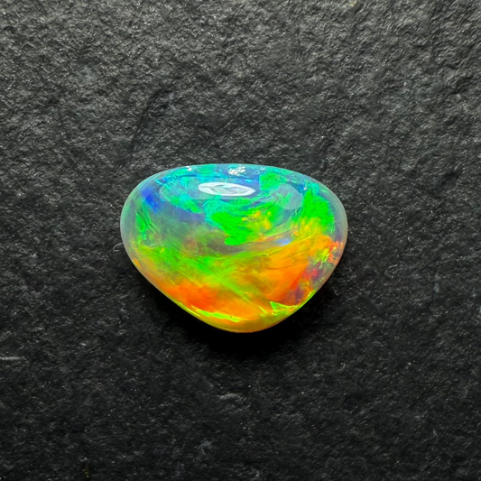 0.58ct World Class Crystal Opal, This Gem Has A Brilliant Orange To Green Color Transition Across The stone.