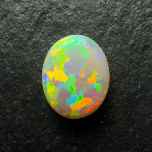 0.7ct Dark Opal, This Stone Has A Lovely Blocky Floral Pattern And A Pastel, Multi-color Palette