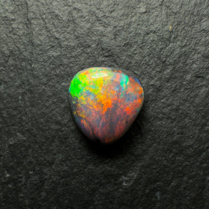 0.64ct Gem Black Opal With A Lovely Red Multi-Color Palette And Small Flash Pattern
