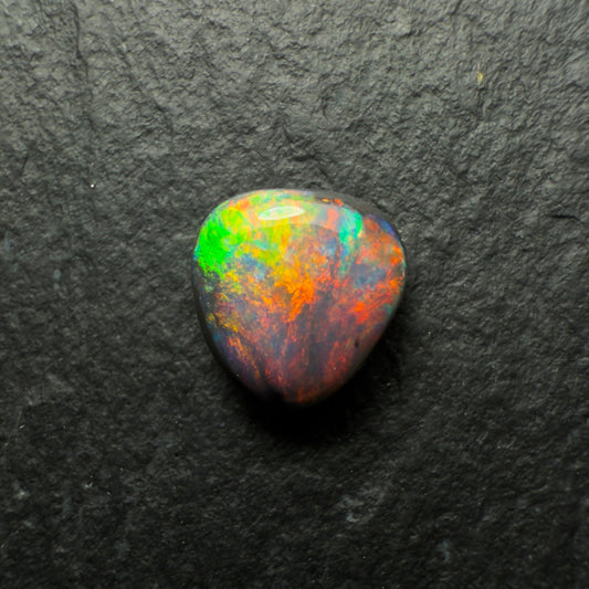 0.64ct Gem Black Opal With A Lovely Red Multi-Color Palette And Small Flash Pattern