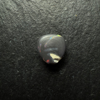 0.64ct Gem Black Opal With A Lovely Red Multi-Color Palette And Small Flash Pattern