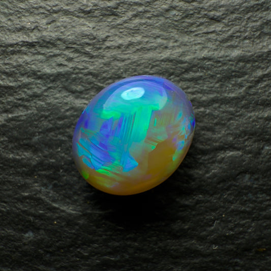 0.92ct Dark Crystal Opal, This Stone Has A Minty Green-Blue Color Pallet And A Mixed Paintbrush And chaff Pattern With Lots Of Depth