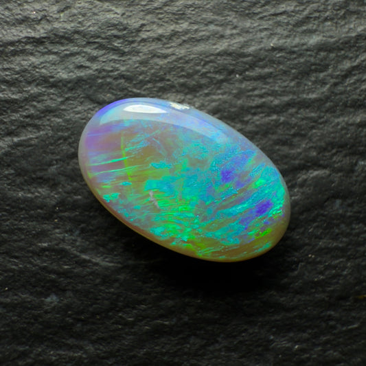 1.0ct Dark Opal, This Gem Has A Minty Green-Blue Color Palette And A Textured Broadflash Pattern