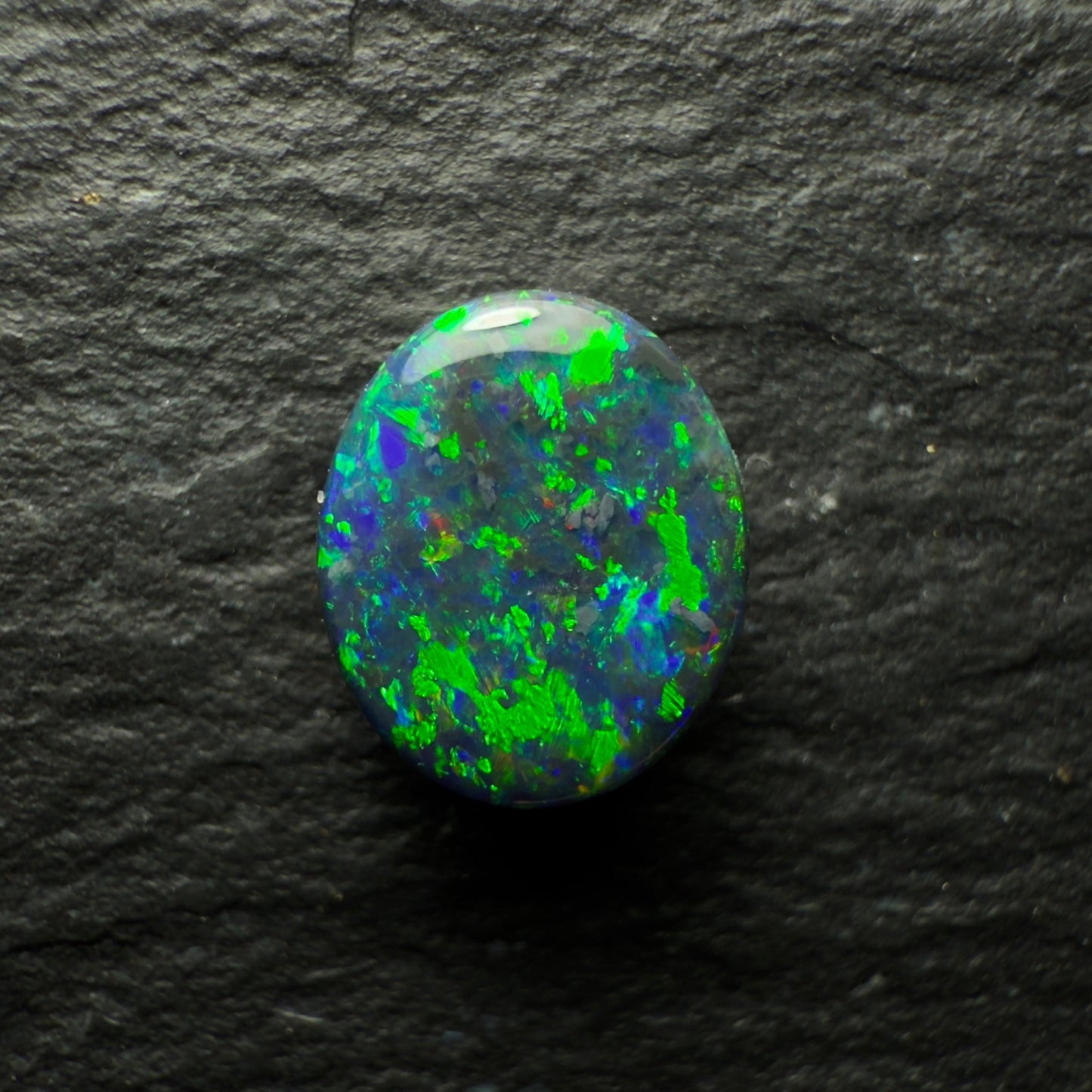 0.76ct Black Opal, This Gem Has Speckled mossy Pattern With A Green, Blue Color Play