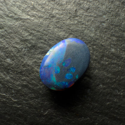 0.88ct Black Opal, This Gem Has A Dark Blue-Green Color Palette With A Mossy Pattern