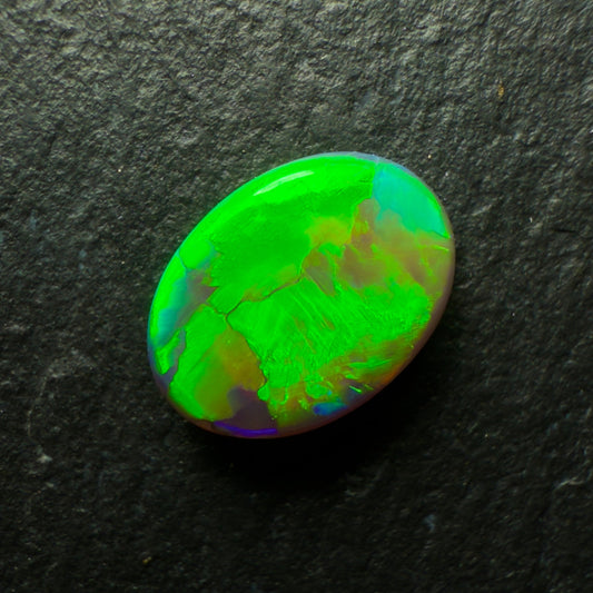 1.0ct Black Opal, This Gemm Has A Blindingly Bright Green Gold Color Palette And A Broadflash Pattern