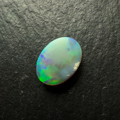 1.0ct Black Opal, This Gemm Has A Blindingly Bright Green Gold Color Palette And A Broadflash Pattern