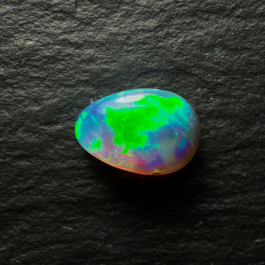 1.02ct Black Opal, This Gem Has A Vivid Green-Gold Rolling Broadflash Pattern