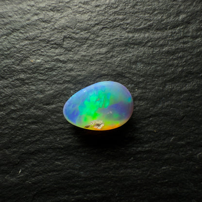 1.02ct Black Opal, This Gem Has A Vivid Green-Gold Rolling Broadflash Pattern