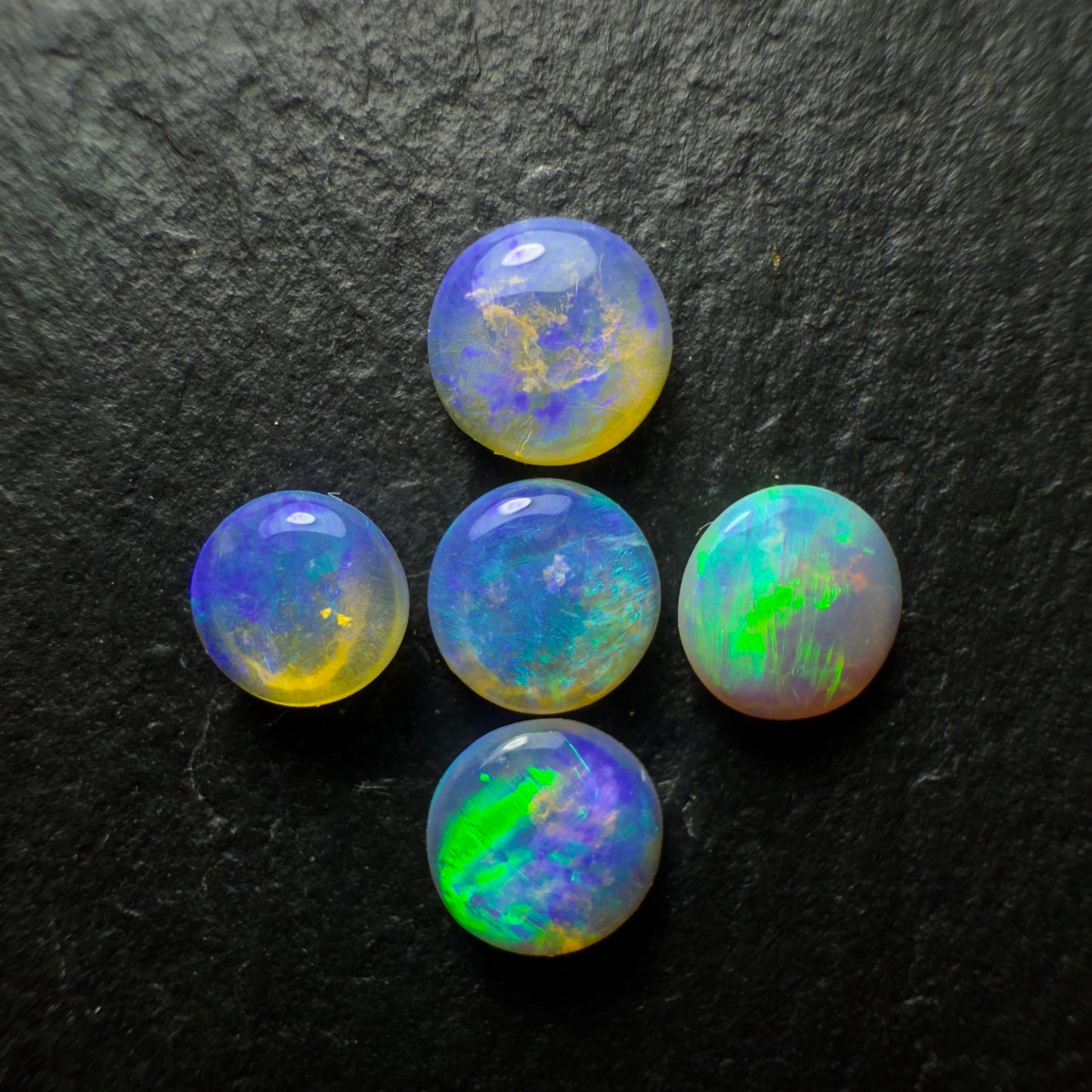 (Price For Parcel) 26 Small Crystal opals rounds, With Blues Green And Purple