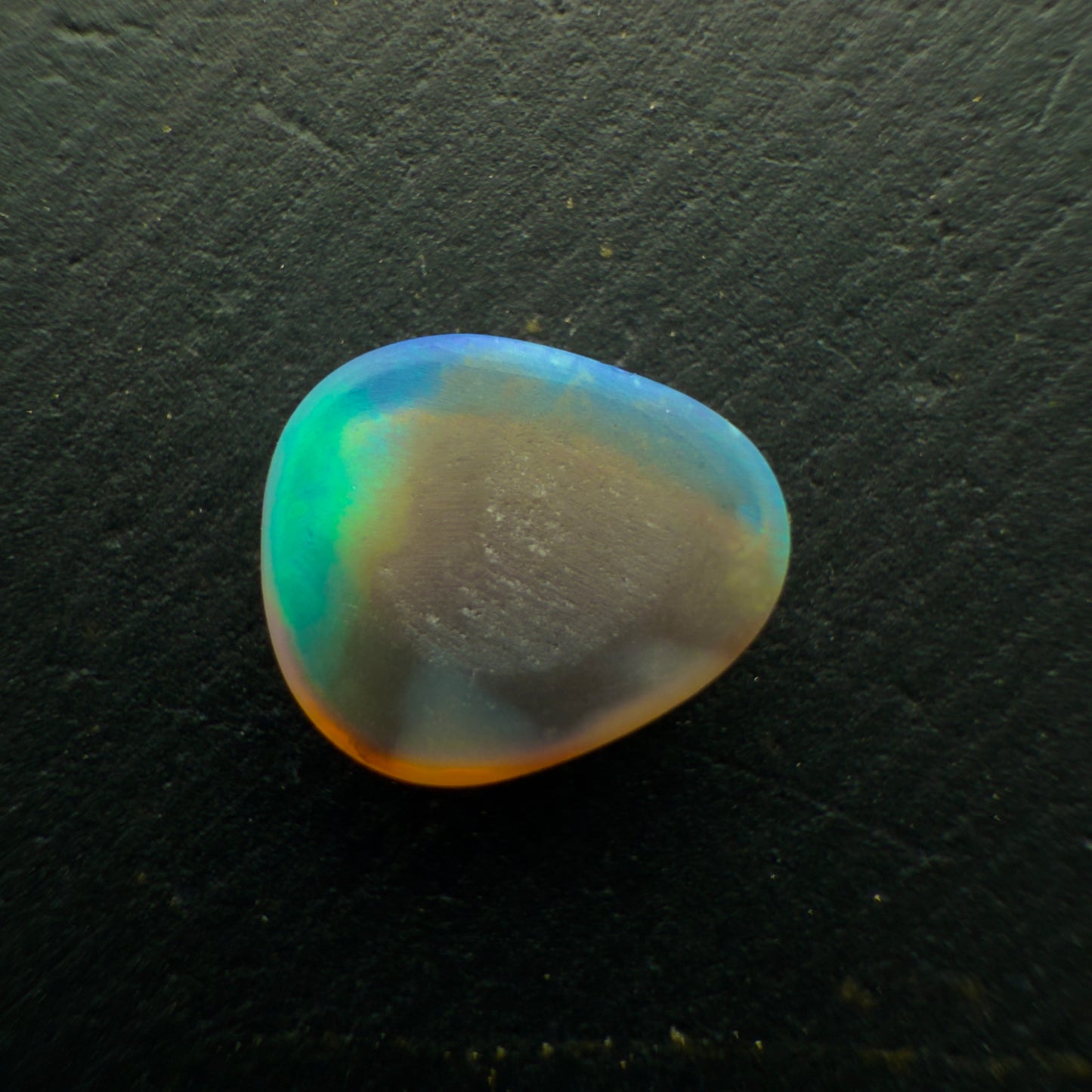 0.7ct Black Opal, This Stone Has An Vivid Green-Blue Rolling flash