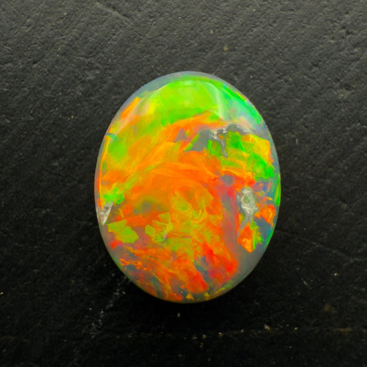 1.3ct Black Opal, With A vivid Orange Gold Color Palette And full faced Color